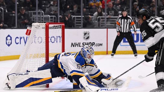 St. Louis Blues goaltender Jordan Binnington (50) makes a save on Los Angeles Kings right wing Quinton Byfield (55) during overtime at Crypto.com Arena on March 5, 2025, in Los Angeles, California.