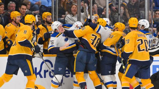 St. Louis Blues defenseman Tyler Tucker (75) and Nashville Predators left wing Cole Smith (36) trade punches during a third-period fight at Bridgestone Arena on March 18, 2025.
