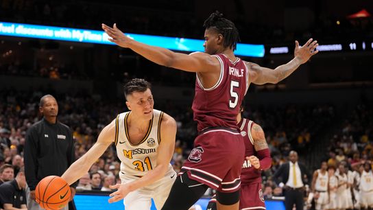 Missouri Tigers guard Caleb Grill (#31) passes the ball while South Carolina Gamecocks forward Nick Pringle (#5) defends during the second half at Mizzou Arena on Feb. 25, 2025, in Columbia, Missouri. Missouri Tigers guard Caleb Grill (#31) passes the ball while South Carolina Gamecocks forward Nick Pringle (#5) defends during the second half at Mizzou Arena on Feb. 25, 2025, in Columbia, Missouri.